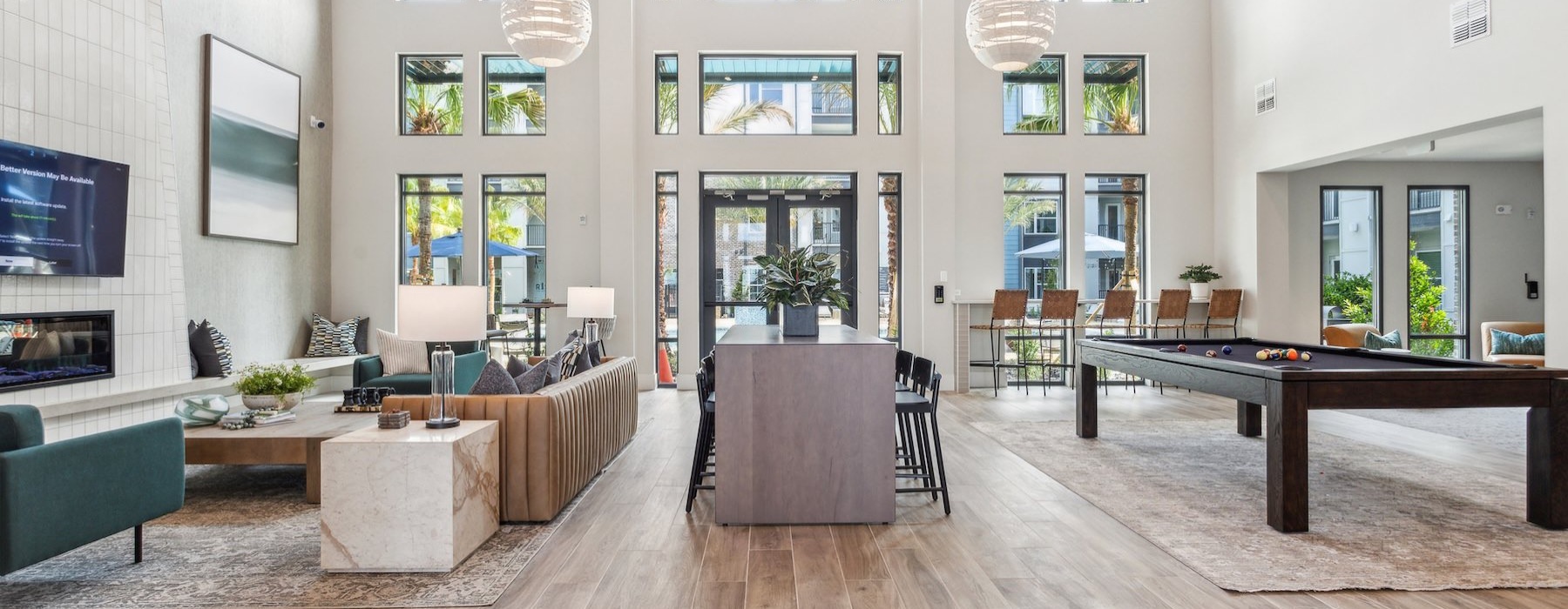 a large room with a wood floor and a large window